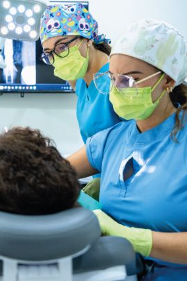 Experienced Cabo San Lucas dentists delivering a personalized smile makeover treatment for an adult patient.