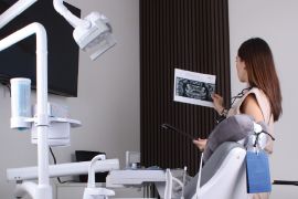Expert dentist in Cabo analyzing patient radiographs to design a personalized treatment plan.