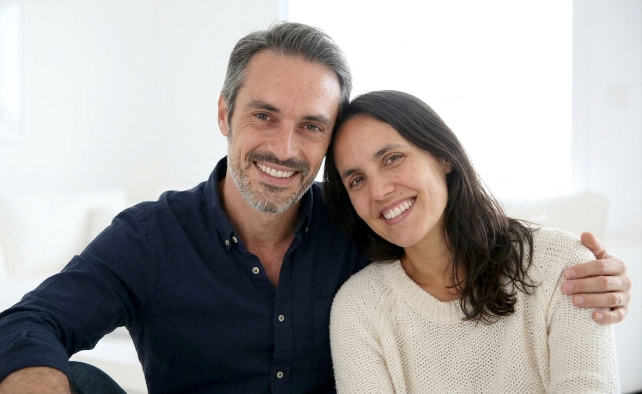 Couple smiling after smile makeover treatment in Los Cabos