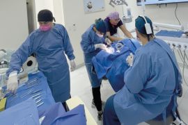 Expert dentist in Cabo San Lucas performing a premium dental implant procedure at Unique Dental clinic.