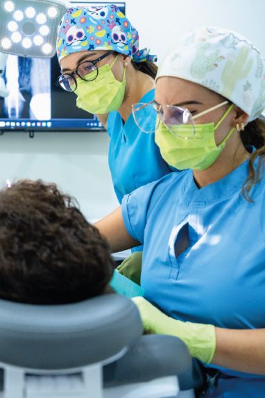 Experienced Cabo San Lucas dentists delivering a personalized smile makeover treatment for an adult patient.