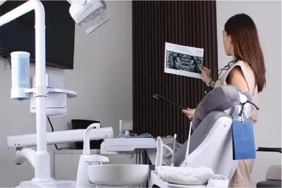 Expert dentist in Cabo analyzing patient radiographs to design a personalized treatment plan.