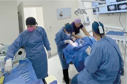 Expert dentist in Cabo San Lucas performing a premium dental implant procedure at Unique Dental clinic.